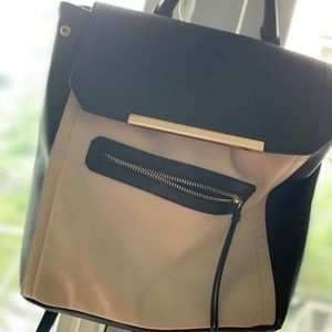 TAN AND BACK PURSE w/ backpack straps and a handle